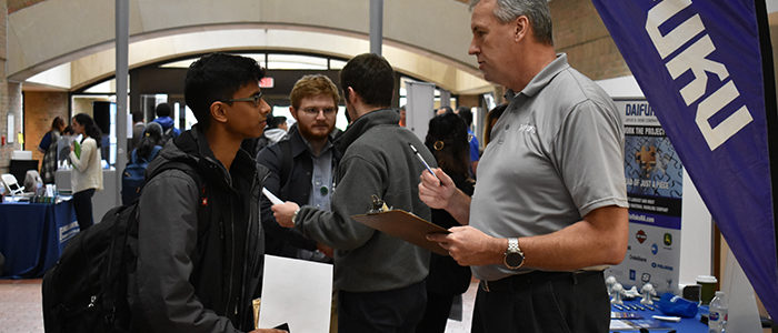 Employers at the Career Fair Giving Advice to Students